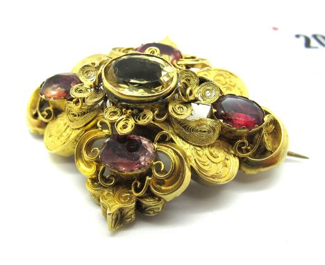 A Large Victorian Locket Back Brooch, of shaped design with filigree detail and oval collet set highlights, the reverse set t