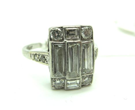 A c.Early XX Century Diamond Set Panel Ring, the rectangular panel rubover set with brilliant and baguette cut stones, stampe