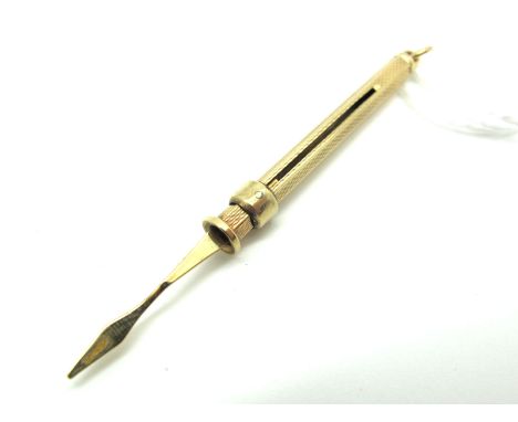 A 9ct Gold Engine Turned Sliding Tooth Pick, (extended length 6.5cm).