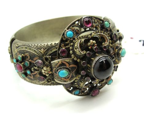 A Highly Decorative Continental Style Wide Hinged Bangle, allover decorated with collet set highlights graduated to the front