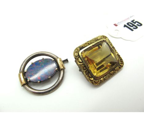 A Large Citrine Single Stone Brooch, rectangular collet set within textured border; A Black Opal Doublet Set Brooch, the (19x