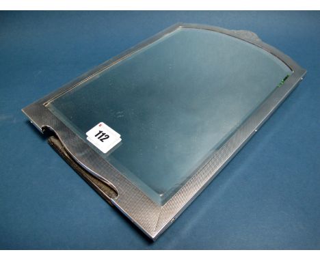 A Hallmarked Silver Framed Freestanding Mirror, Mappin &amp; Webb, Birmingham (marks rubbed), of shaped design, engine turned