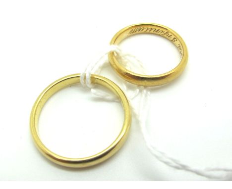 An 18ct Gold Wedding Band, (finger size K); Together with Another, stamped "18ct" (finger size Q½) (total weight 7grams). (2)