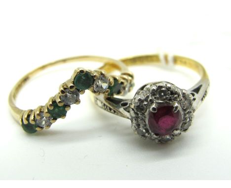 An 18ct Gold Ruby and Diamond Cluster Ring, claw set to the centre within illusion set border, Birmingham 1960 (finger size L