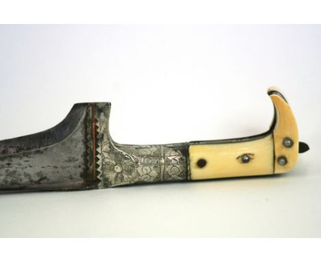 A 19th Century ivory and steel dagger, in leather scabbard, probably Khyber, 31.5cm