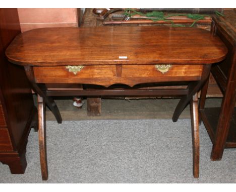 A 19th Century mahogany side table, the oblong overhanging top above two short drawers, raised on cross supports, united by a