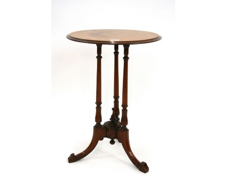 A Victorian mahogany occasional table, the circular top raised on turned columns and tripod base, 47.5cm dia.