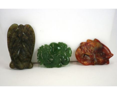 Three Jade and hardstone pendants, in the form of a Cicada, a carp and a dragon