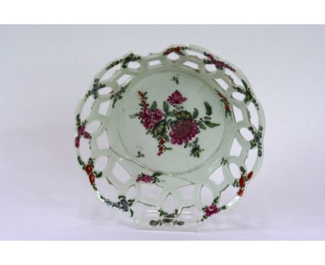 An 18th Century English porcelain scallop bordered plate, decorated foliate sprays and butterflies, red anchor mark to the ba