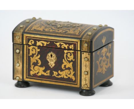 A lacquered leather and brass mounted two compartment tea caddy, of domed shape, 18.5cm x 13cm high 