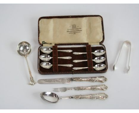 A cased set of six silver coffee spoons, Sheffield 1948; a pair of silver sugar tongs with embossed foliate decoration, Sheff