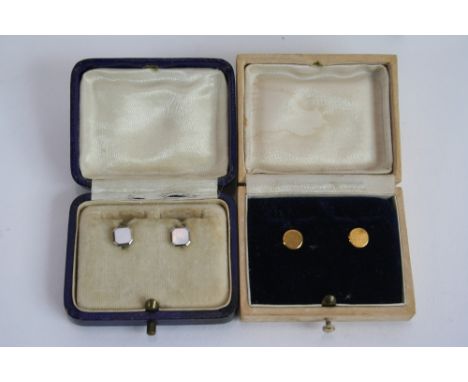 A pair of 9ct gold dress studs with engine turned decoration and another pair with mother of pearl decoration