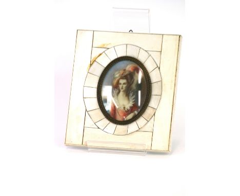 A pair of miniature portrait studies of fashionable ladies, in faux ivory frames