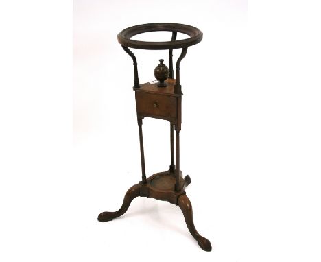 A small Georgian mahogany washstand/wig stand, fitted with a single drawer, raised on turned spindle column supports and trip