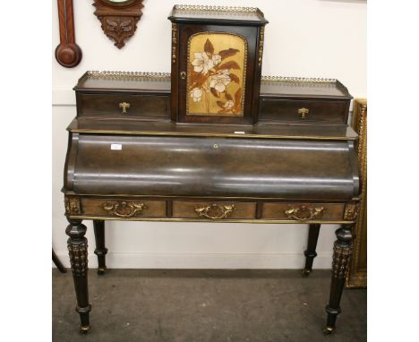 A late 19th Century mahogany and brass mounted writing desk, having bowed fall front that opens to reveal a maple lined pull 