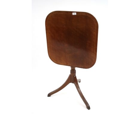 A Georgian mahogany and boxwood strung occasional table, the rectangular tilt top raised on a turned baluster column and reed