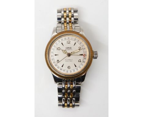 AN ORIS AUTOMATIC WRISTWATCH with two tone cream textured dial with gold coloured chevron and Arabic numerals and main hands.