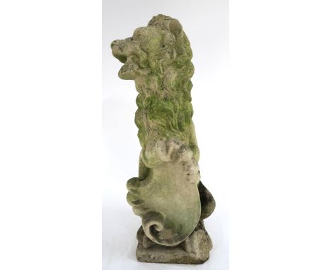 A 19TH CENTURY SCOTTISH CARVED STONE HERALDIC LION GATE FINIAL with seated lion bearing a blank scroll on a square plinth bas