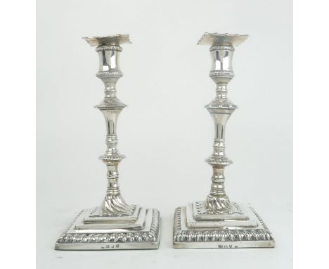A MATCHED PAIR OF GEORGE III SILVER CANDLESTICKS one with maker's mark IC, London 1770, another maker's mark W (Listed under 