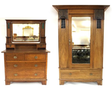 A HARRIS LEBUS ARTS &amp; CRAFTS TWO PIECE BEDROOM SUITE comprising wardrobe with shaped cornice over single mirrored door fl