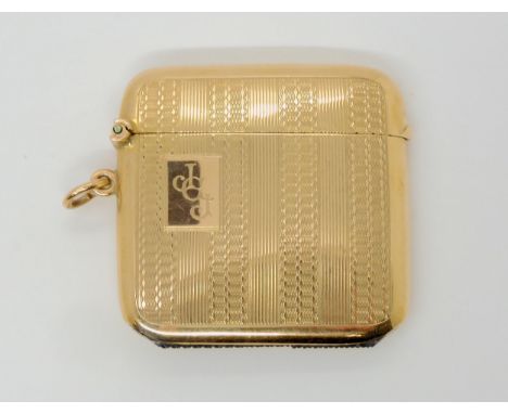 A 9CT GOLD VESTA with all over linear engine turned engraving, hallmarked Birmingham 1926, made by John Henry Wynn. Dimension