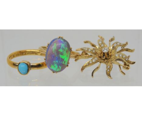 AN OPAL RING AND OTHER ITEMS The solid black opal has lively green, purple and blue colour play, and is mounted in a vintage 