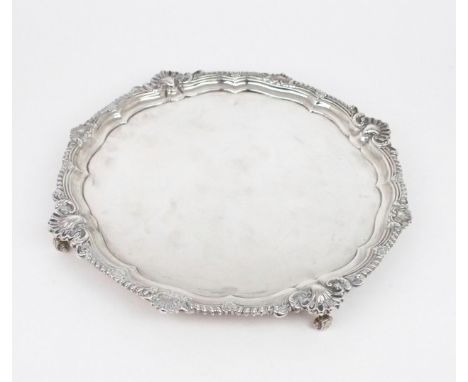 AN EDWARDIAN SILVER SALVER by&nbsp;Harrison Brothers &amp; Howson, London 1903, of plain form, with a gadrooned shellwork bor