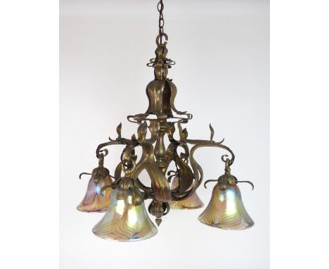 A BRASS ARTS AND CRAFTS HANGING LIGHT with later iridescent glass shades, 56.6cm x 59cm high, 104 cm high including chain and