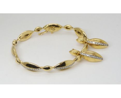 A DIAMOND BRACELET AND EARRINGS made by Lime Blue, the pod shaped links are set with a line of brilliant cut diamonds, with a