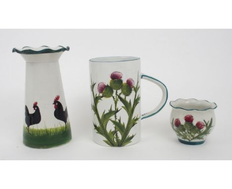 A WEMYSS GROSVENOR VASE painted with a black cockerel and hens, 20cm high, together with thistle painted tankard and fern pot