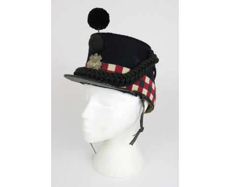 A LATE-VICTORIAN HIGHLAND LIGHT INFANTRY SHAKO The body of deep blue wool cloth, with chequered red, white and blue banding a