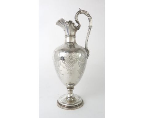 A VICTORIAN SILVER EWER by Edward & John Barnard, London 1855, of baluster form, the body engraved with interlocking geometri