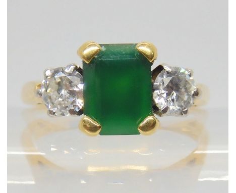 AN EMERALD AND DIAMOND RING the 18ct gold ring set with a step cut emerald 8mm x 6mm, and two diamonds with an estimated appr