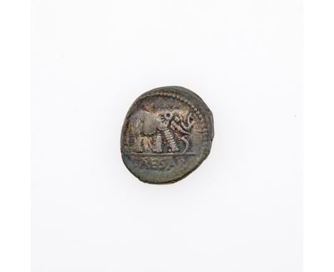 OBVERSE: Elephant (right) trampling serpent with legend CAESAR in exergue; REVERSE: Priestly implements: simpulum, sprinkler,