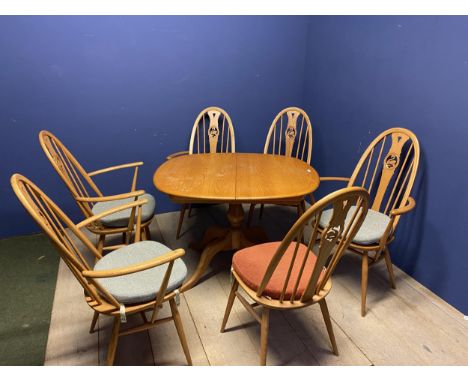 Ercol extending table and 6 Ercol chairs (4 carvers) ( condition - there is a foldaway leaf which has been screwed in the wro