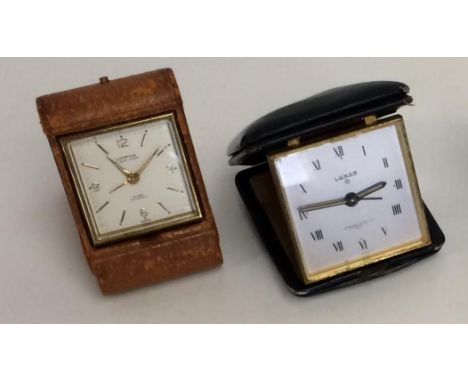 2 travel alarm clocks, one by Luxor, retailed by Garrard &amp; CO, and a leather cased 8 day travel alarm clock; both in used