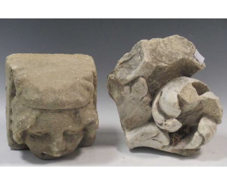 A medieval stone corbel, a stone fragment of a figure holding a lamb on a red velvet stand; and a carved stone fragment (3)Pr