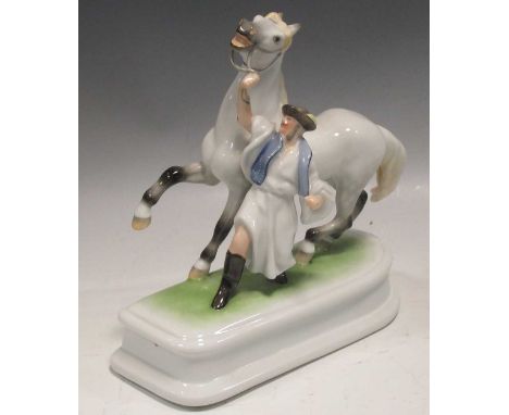 A Herend model of a trainer with a horse, 20 x 20 x 9cmProvenance:Collection of the late Sir Georg and Lady Solti 
