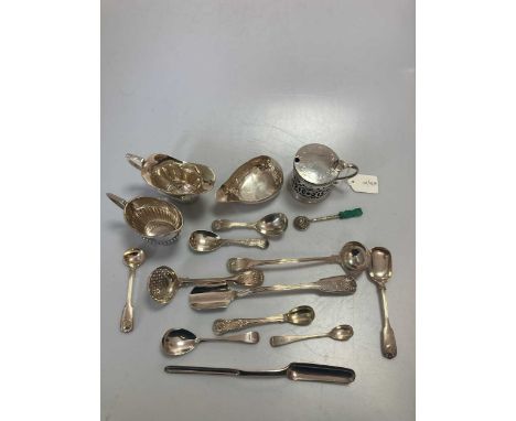 A collection of silver flatware including caddy spoons, cream ladle, sifting spoon, marrow scoop, stilton scoop etc, together