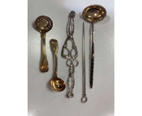 A silver meat skewer, a silver punch ladle a silver sugar sifter, a silver cream ladle, a pair of silver sugar tongs and a pa