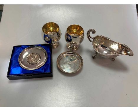 A cased pair of silver brandy snifters, a cased silver sauce boats, a silver pin tray and a Britannia silver pin tray with a 