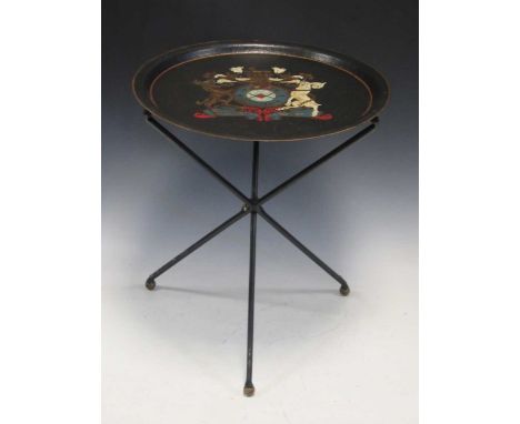 A tole-painted folding table / fire screen decorated with a crest, 52 x 44cm