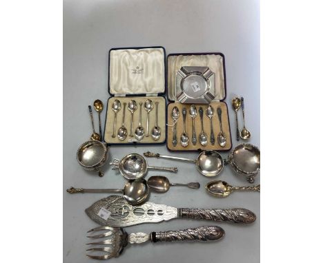 A collection of silver including a pair of silver fish servers with filled handles, 2 cauldron salts, 2 apostle spoons, 4 Rus