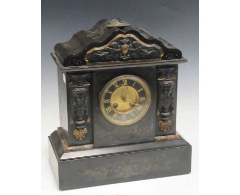 A Victorian slate mantel clock dial encased in the centre of two columns decorated with female busts, 35 x 31 x 15.5cm