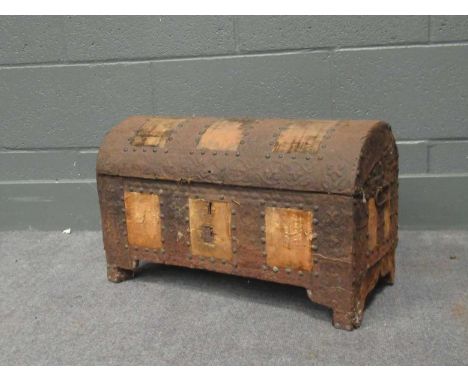 A continental renaissance style domed topped trunk with punched leather and fabric decoration 33 x 55 x 26cm