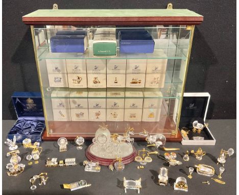 Swarovski Crystal Memories - a collection of crystal miniatures, including mobile phone, tricycle, spinning wheel, penny fart