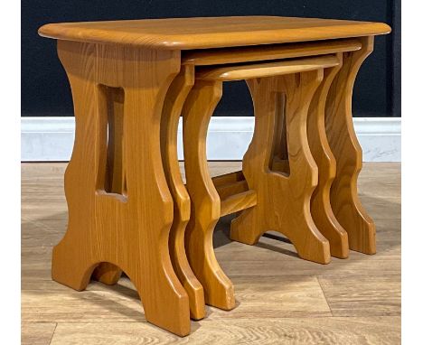 An Ercol Chantry elm nest of three occasional tables, model 498, the largest 42cm high, 56.5cm wide, 34.5cm deep 