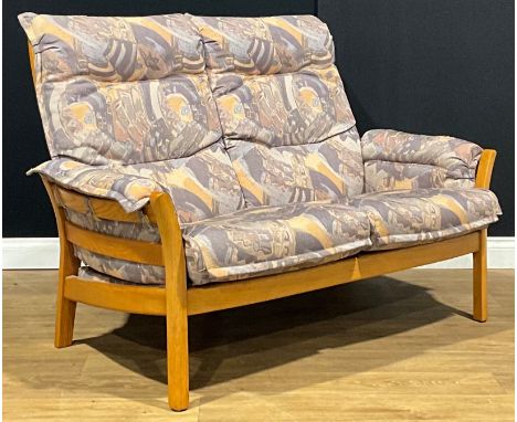 An Ercol Saville sofa, model 9302, 96cm high, 141cm wide, the seat 106cm wide and 52cm deep 