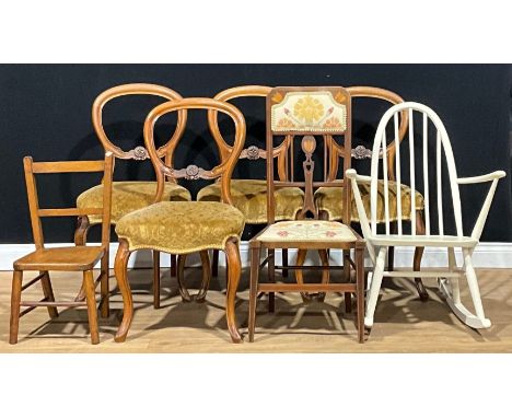 A set of four Victorian walnut balloon back dining chairs; a painted Ercol rocking chair; a child’s chair, stamped EG; an Art