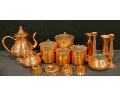 A Portuguese brass tea set, comprising teapot, wooden finial, sucrier, and cream jug; a graduated set of brass and steel kitc